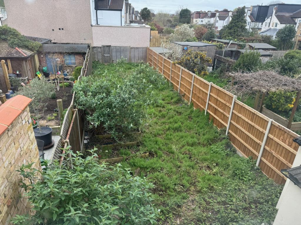 Lot: 135 - TERRACE HOUSE FOR TOTAL REFURBISHMENT - Rear garden as viewed from first floor rear bedroom